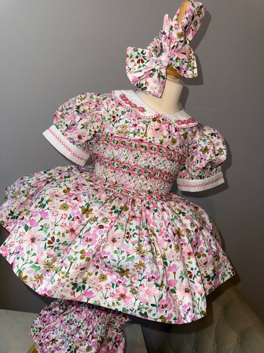 Pink floral dress with pink smocking and pearls