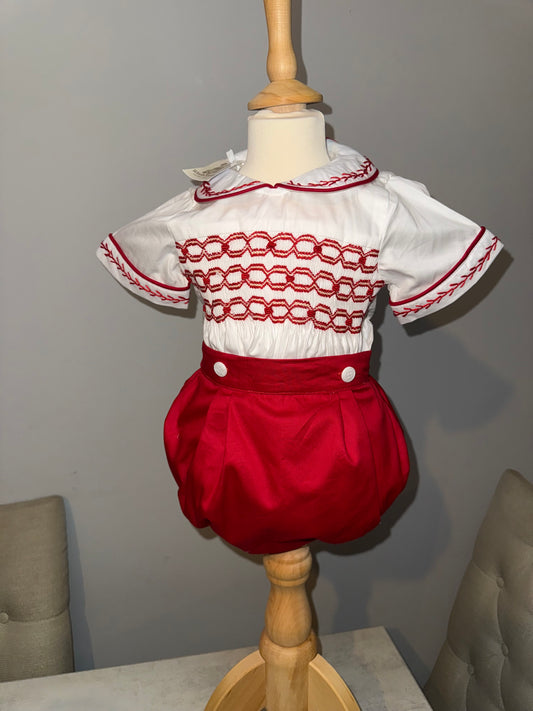 Red smocked romper suit